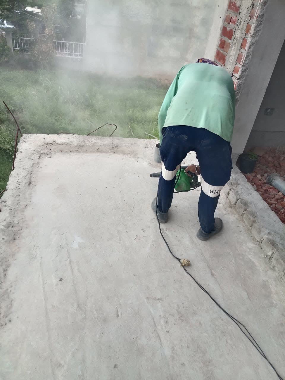 Deep penetrating polymer primer coat application on concrete terrace slab in Mohali