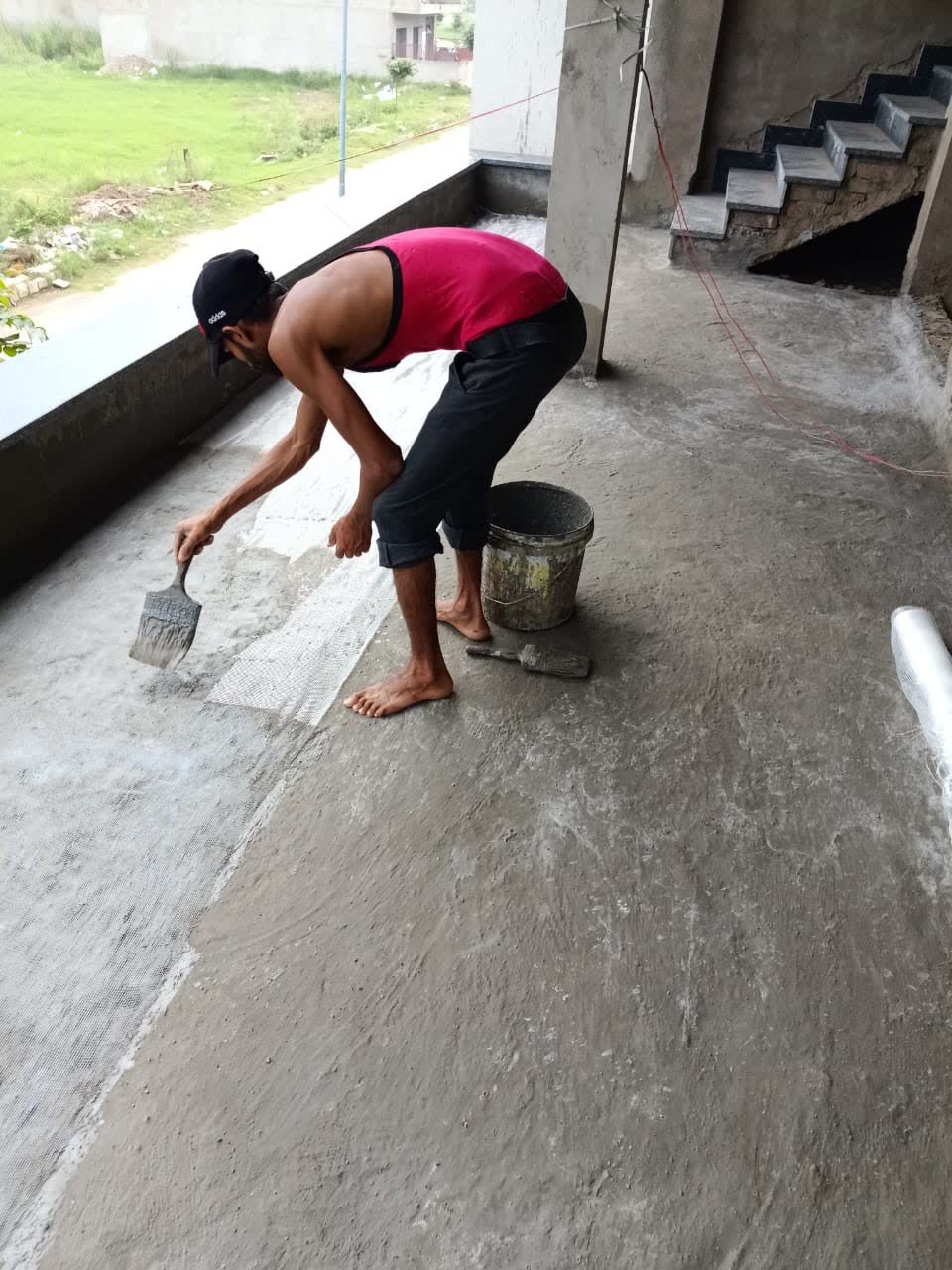 First coat application of elastomeric waterproof barrier membrane in Chandigarh