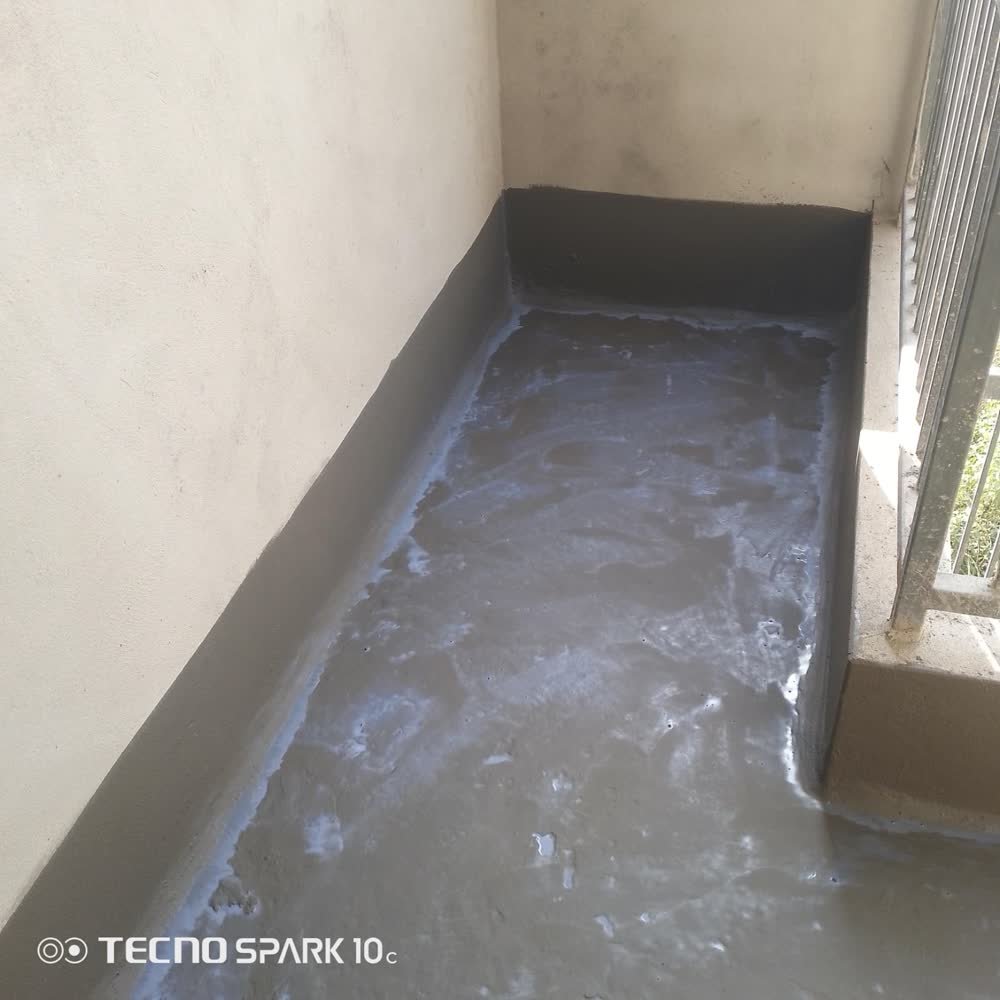 Controlled curing phase of newly applied waterproof concrete rooftop in Sector 52